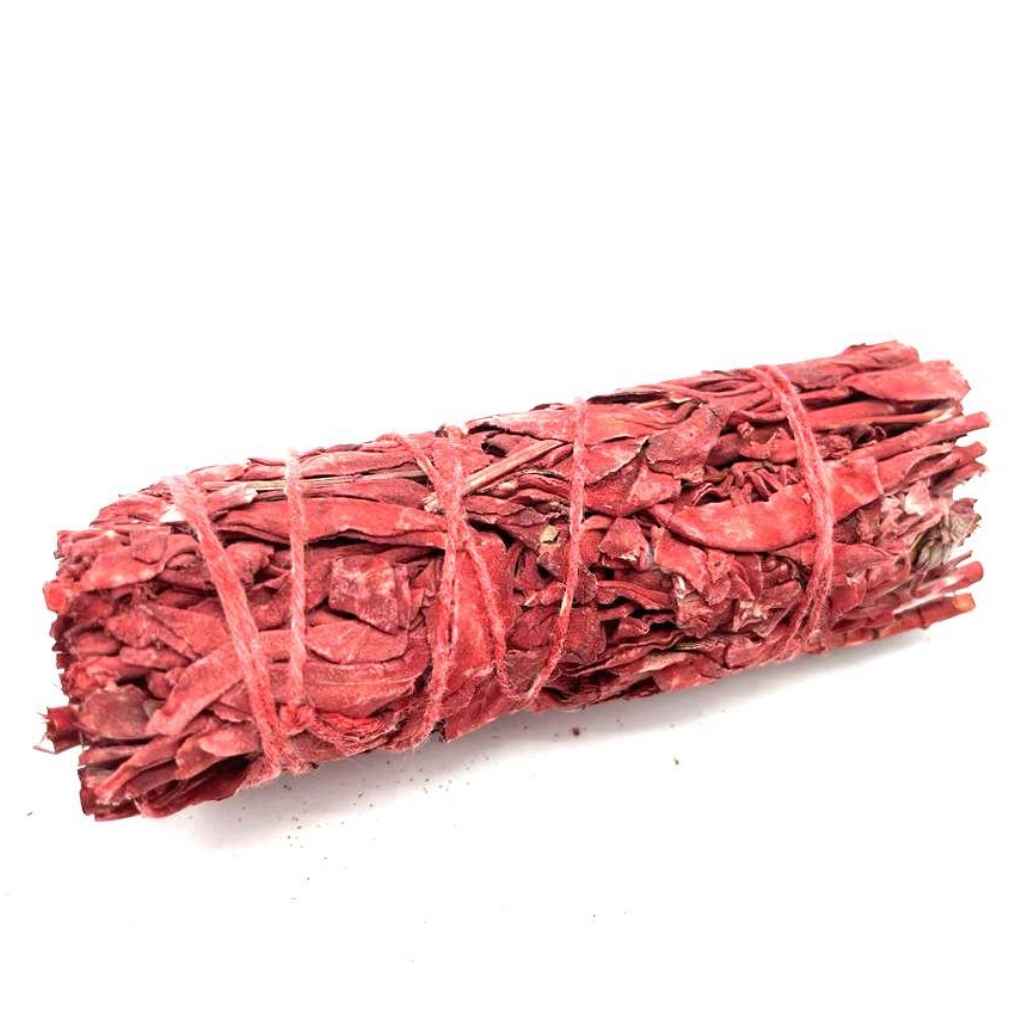 10cm dragons blood sage smudge stick against a plain white background. The dragons blood sage smudge stick is bound with red  twine.
