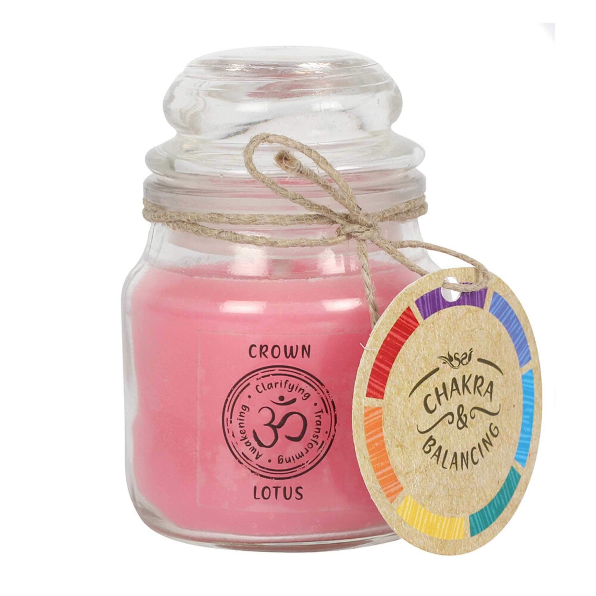 Balancing Chakra Candle in a min glass jar with stopper. Tied with a label that says Chakra Balancing. Candle is pink with a label on the jar that says Crown - Lotus